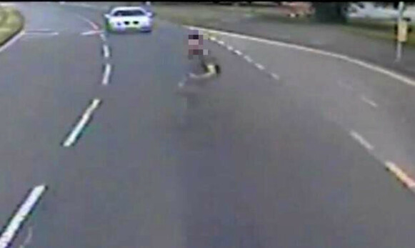 Crossing the road: The perpetrator was captured by CCTV just before the murder.  Photo: the police