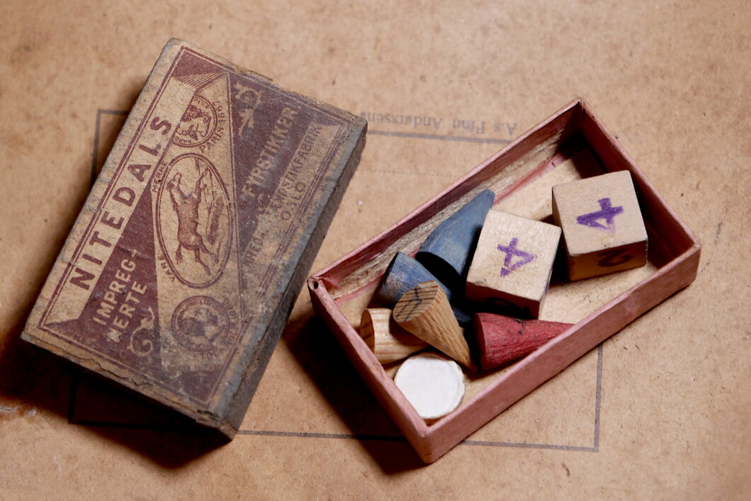 In the matchbox there are board game pieces.