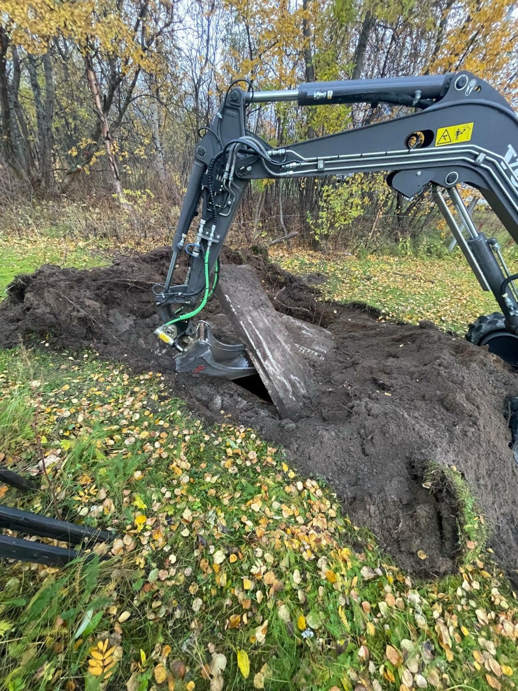 Daniel Valstad received help from a neighbor using an excavator.