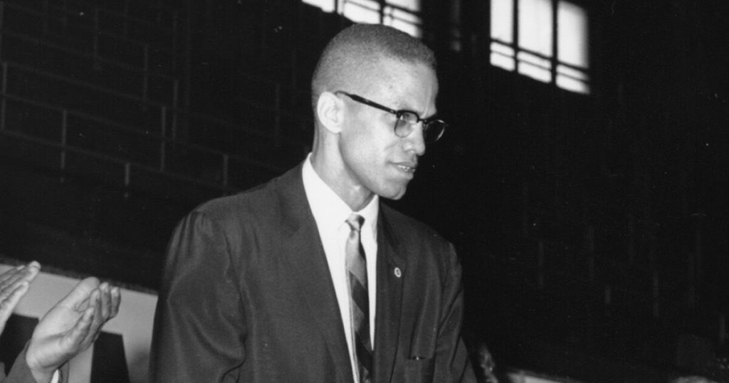 A New York judge pardons two men for the murder of Malcolm X.