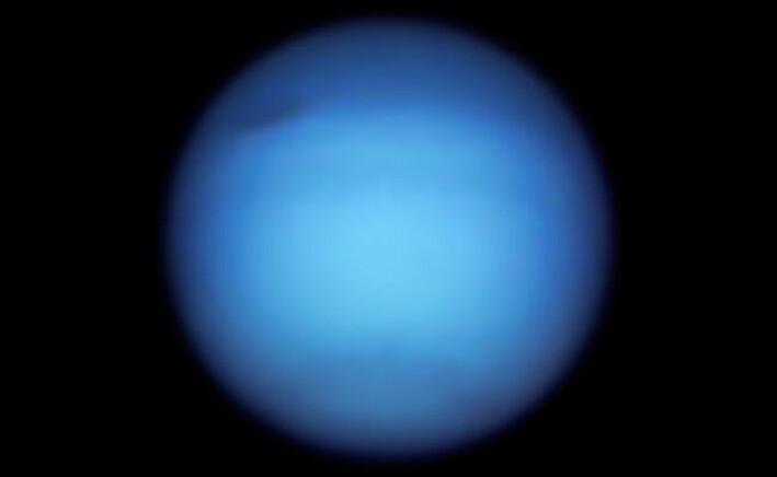 Set Neptune on September 7.  You can glimpse the dark spot in the upper right part of the planet.