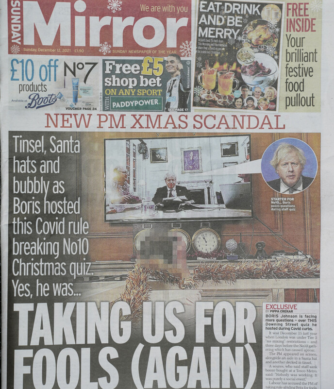 BREAKING CORONAVIRUS RULES: A front page image from The Mirror on Sunday 12 December with a picture of Prime Minister Boris Johnson sitting with two colleagues in the Prime Minister's Office in December 2020. He is now accused of breaking his own rules.  Photo: Pa Photos / Aaron Chown / The Mirror / NTB