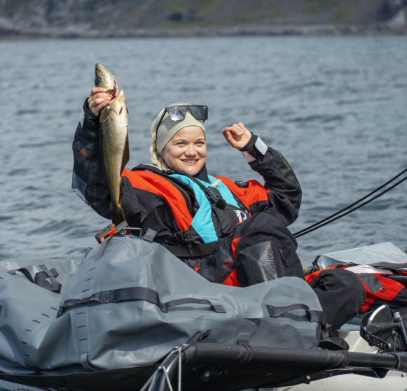 Fishing fun: The cheerful artist smiled widely as she caught a big fish on the hook.  Photo: Geir Evensen/NRK