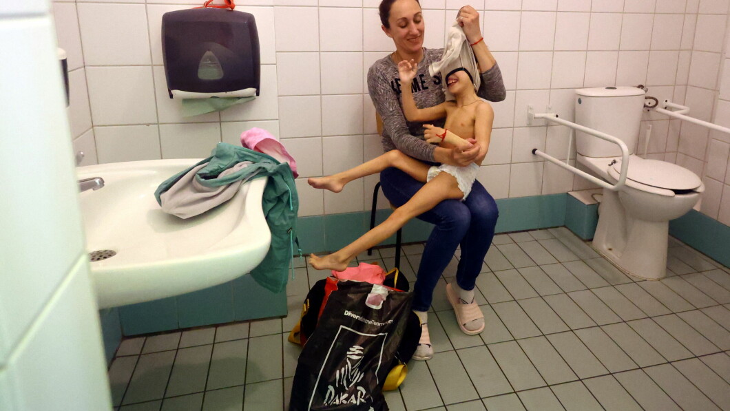 Ukrainian refugee Alexandra Goravil, 38, attends her daughter Aleftina, 8, in the changing room in the swimming pool at the local sports and recreation center in Yaroslav, Poland, March 29, 2022. Zoravel said: 