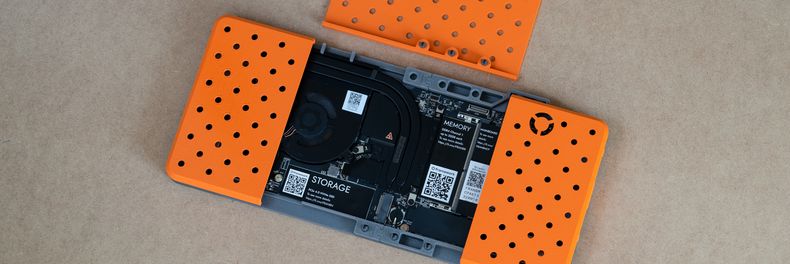 3D printed motherboard frame in orange and gray.