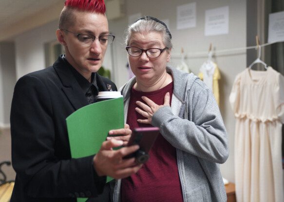 Amish: Mary Byler (left) was born into an Amish community.  Here she is in conversation with Hope Anne Dueck who set up the show.  (AP Photo: Jessie Wardarski