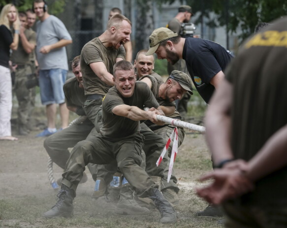 Training: A file photo from 2015 shows conscripts in the Azov Battalion undergoing testing before being sent east toward the front.  Photo: Reuters/Gleb Garanish