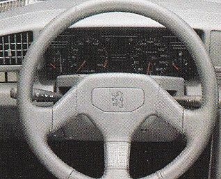A leather-wrapped steering wheel was standard on the Mi16.  Photo: brochure