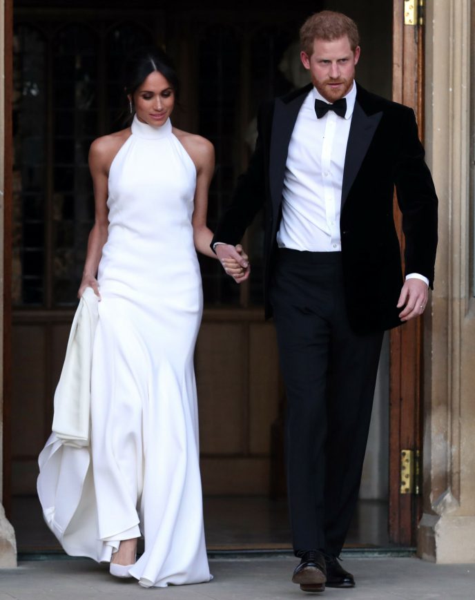 Bare shoulders: Duchess Meghan made a somewhat risky decision with her second wedding dress, when she appeared with bare shoulders.  However, the dress must have been approved by the Queen.  Photo: REX/NTB