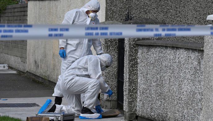 Morder: The police forensic team is investigating the scene.  Photograph: Claudagh Kilcoen/Reuters