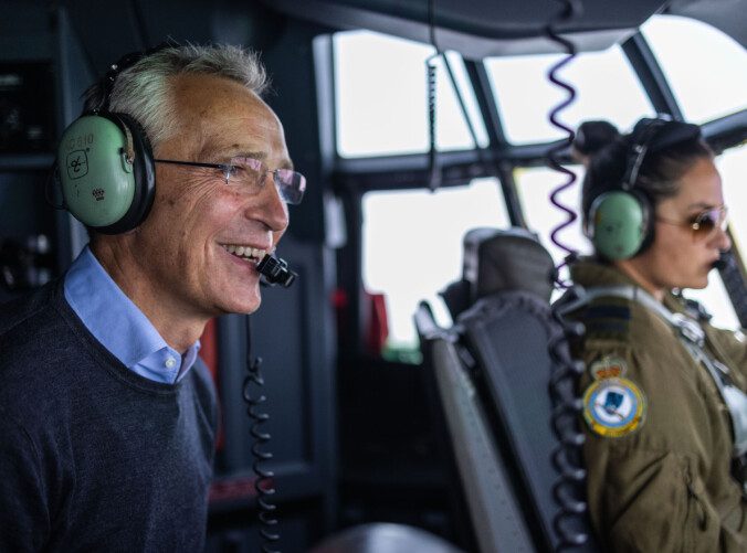 Flight: The NATO chief enjoys the cockpit with Canadian pilots.