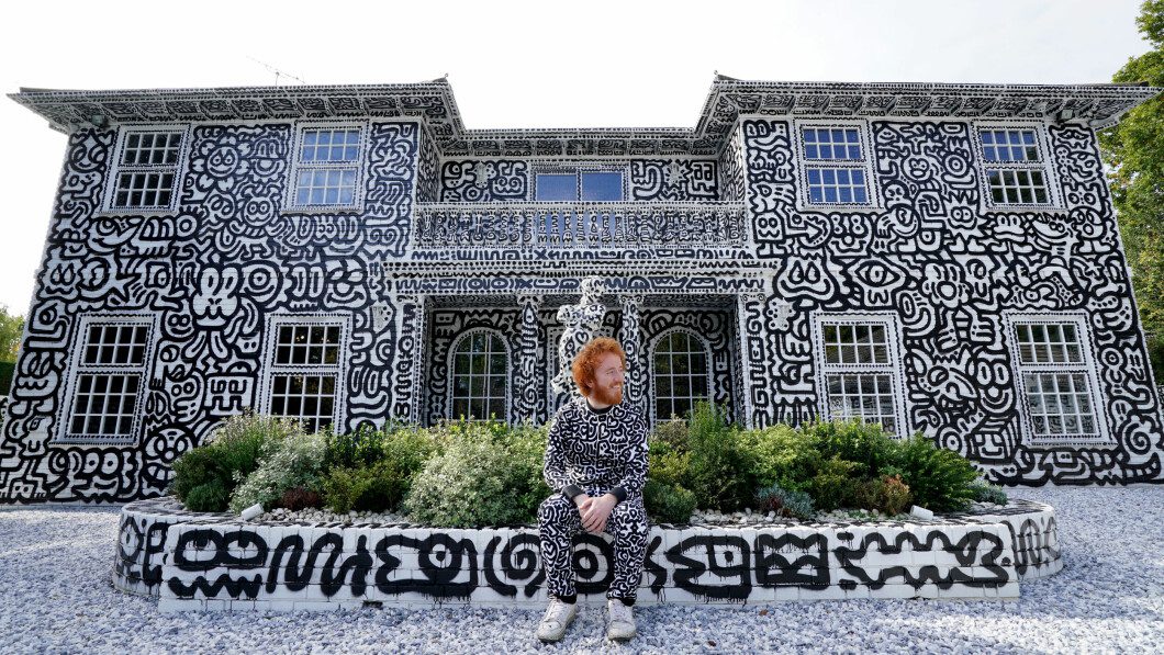 House: Sam Cox also wanted to paint on the outside of the house.  Photo: Gareth Fuller/AP