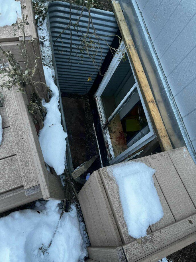 Tocun Canas: A moose, probably foraging, peered out the basement window.  Photo: Soldotna fire service