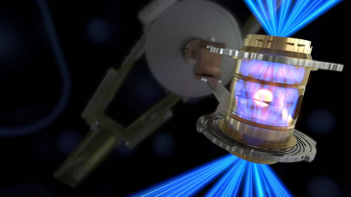 Grafikk som viser en liten sylinder som blir beskutt med mange blå laserstråler for å skape energi. Det viser fusjonsreaktoren som er laget på Lawrence Livermore National Laboratory.